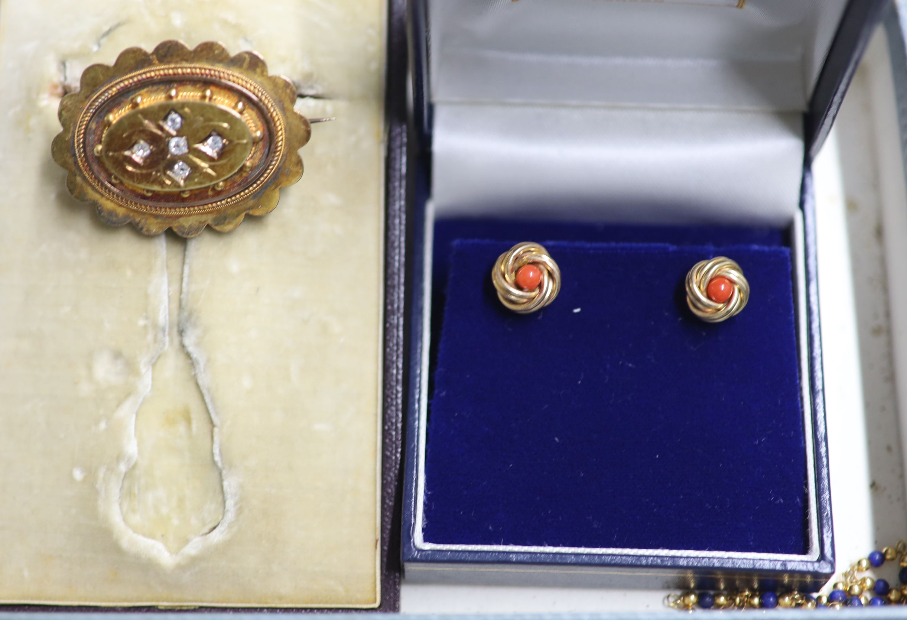A Victorian yellow metal and diamond set shaped oval brooch, with glazed back, earrings and bracelet